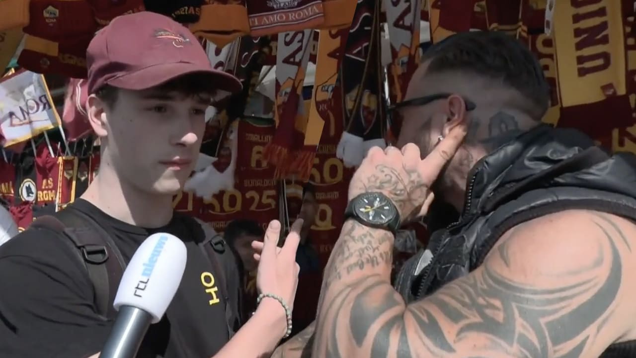 Interview Feyenoord-fan verstoord door gespierde Roma-fan: 'Hier praten we alleen over Roma'