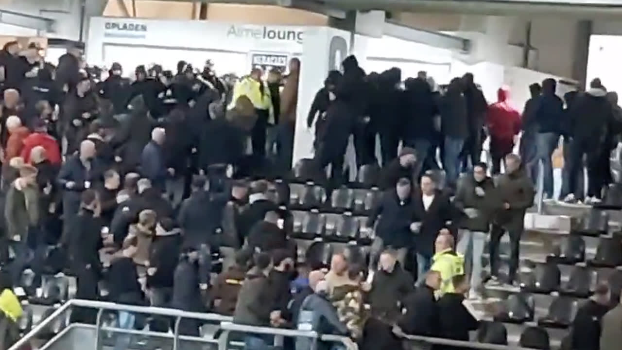 VIDEO: fans van Heracles Almelo en Ajax met elkaar op de vuist in thuisvak