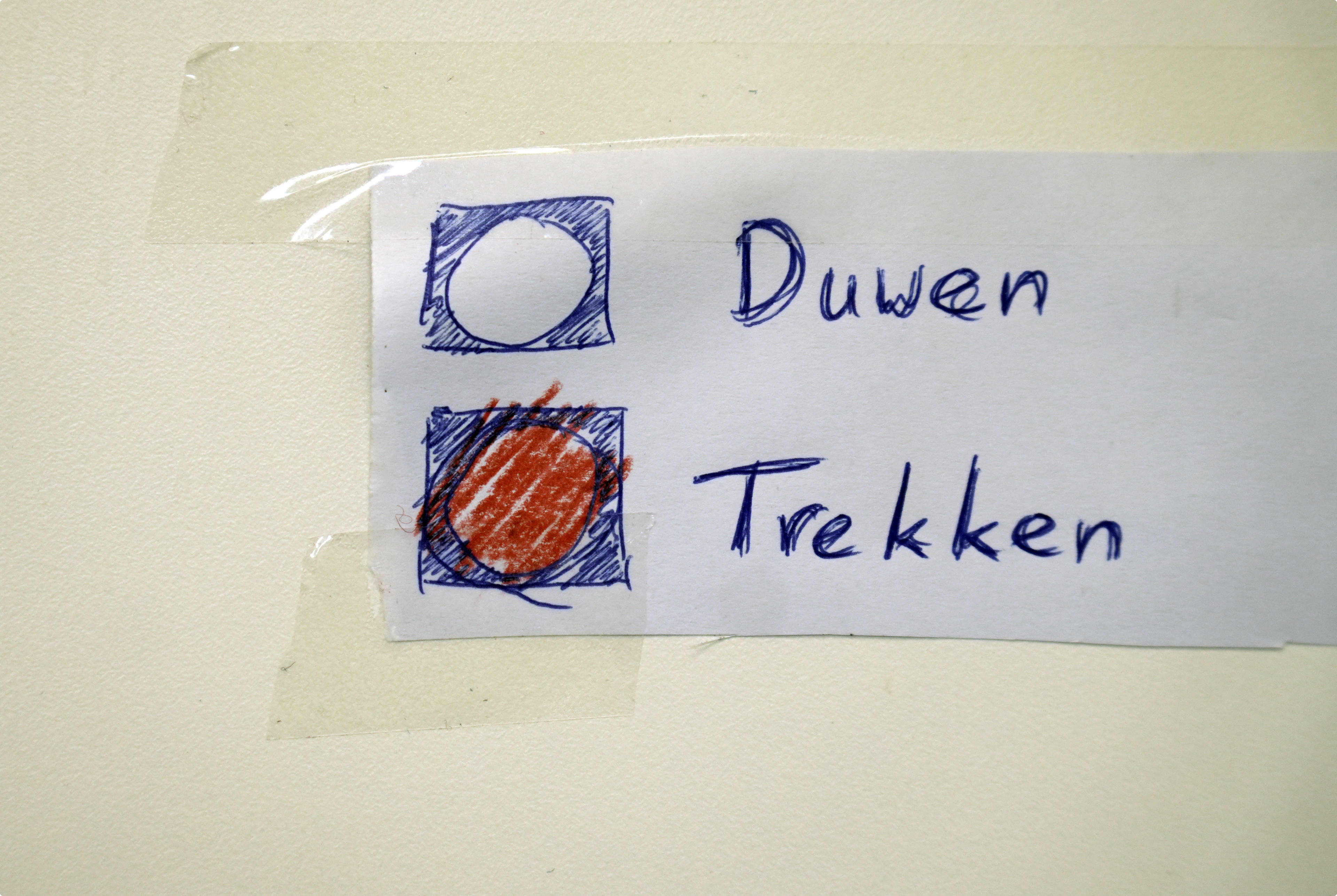 Hoe moet die deur open? Trekken, niet duwen. Beeld: ANP