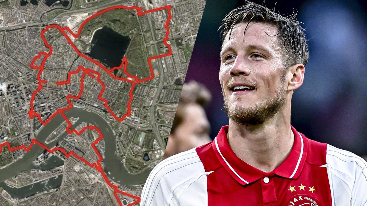 Ajax-fan fietst clublogo door de straten van Rotterdam