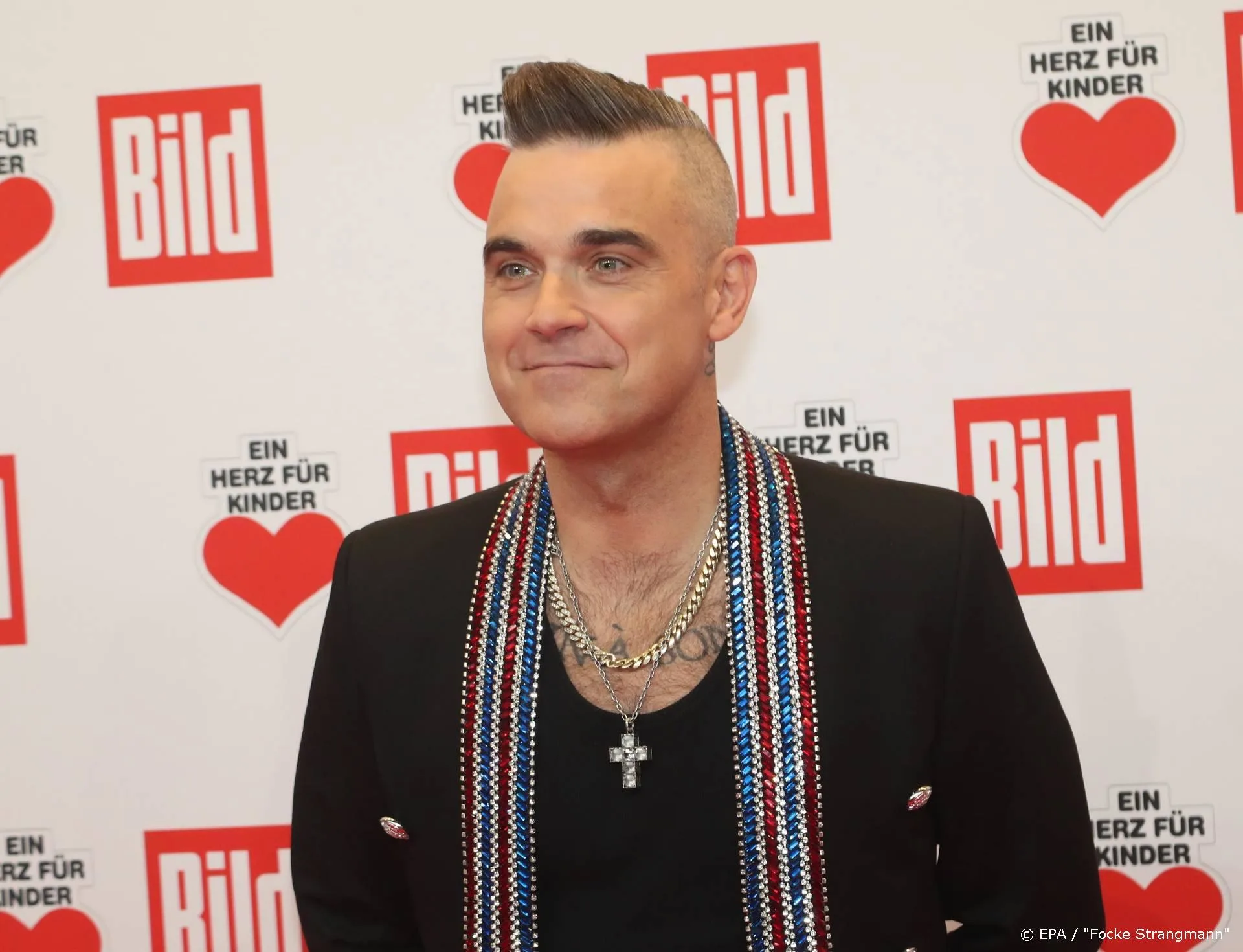 Robbie Williams wil met Liam Gallagher knokken voor goede doel