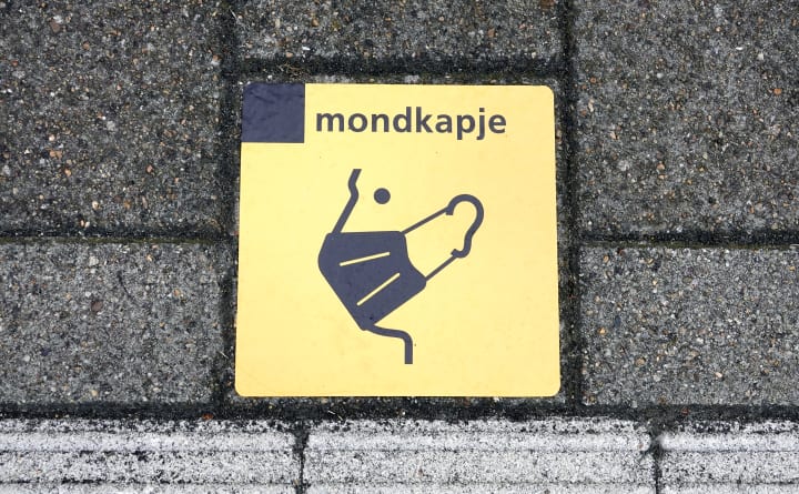 Erg lullig: er zit een piemel verstopt in dit symbool voor een mondkapje